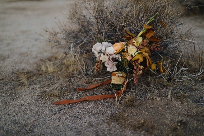 Desert Wedding Bouquet with silk ribbon and orange and yellow flowers at a self solemnization ceremony. 