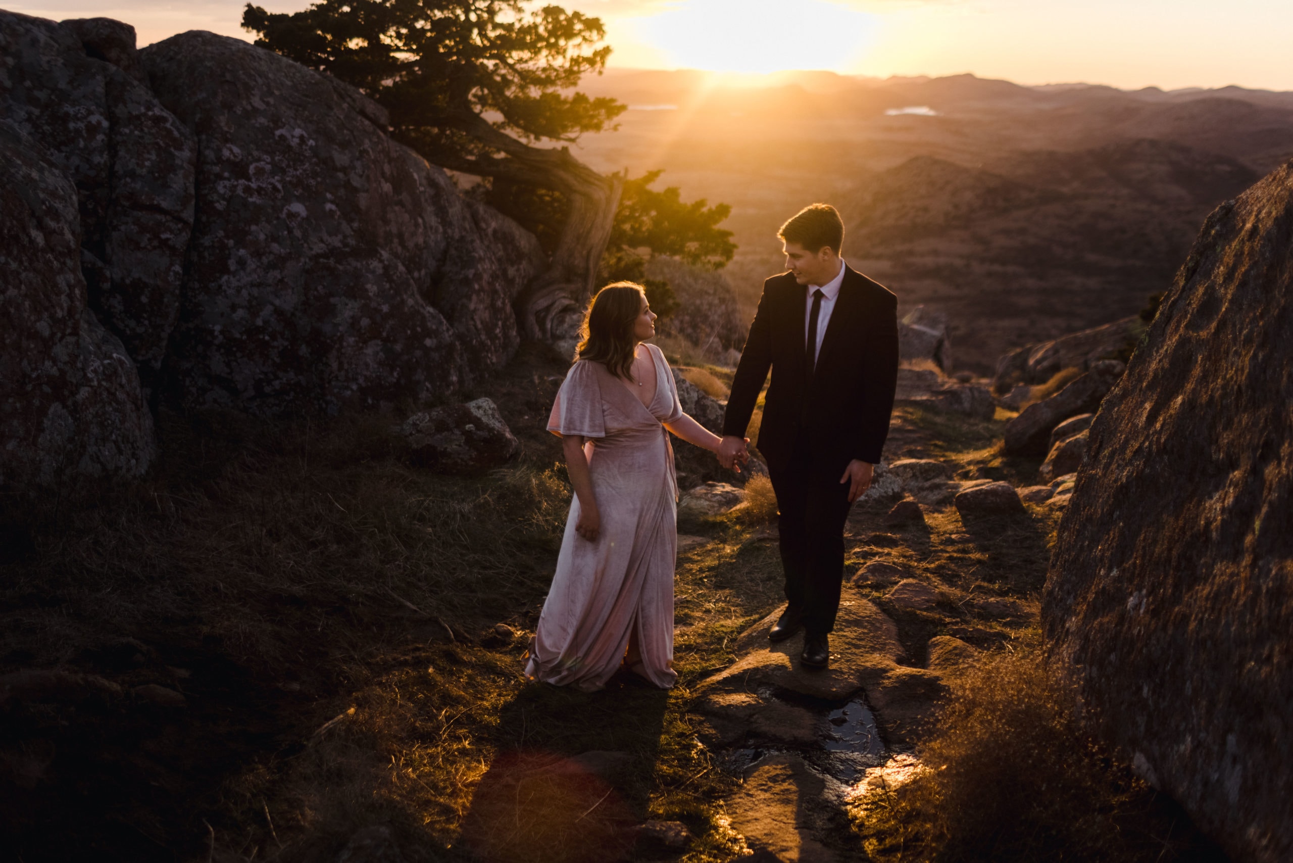 Arik and Emily being on the side of a mountain with the best elopement photographer.